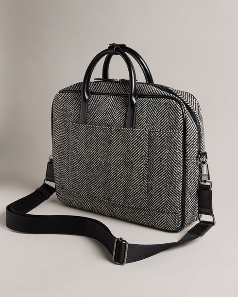 ANDREAZ-Bags-In a timeless herringbone texture, the ANDREAZ document bag combines classic style with modern functionality. It features a handy padded pocket to fit a 15" laptop, plus raised feet to protect it from wear and tear. Document bag Herringbone texture Zip fastening Two top handles with popper fastened holder Magnetic fastened front pocket Padded pocket to fit 15" laptop Raised feet Dimensions: 8cm x 28cm x 40cm- Ted Baker Romania
